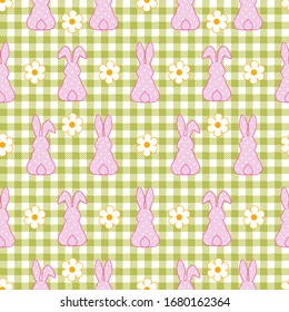 Polka dots Easter Bunny silhouette (back view) and daisy flowers on a checkered background. Vector seamless pattern. Easter design.

