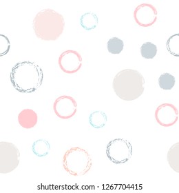Polka dots pastel seamless pattern. Chalk brush hand drawn rounds, hoops, rings endless repeat print, abstract geometric pattern. Trending pastel ornament background. Polka dot vector illustration.