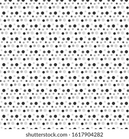 Polka-dot gray shades and different sizes on a white background, artistic. Seamless vector pattern for textile, surface packaging, packaging design. Abstract design.