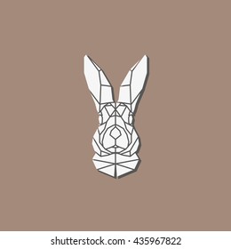 Polygonal abstract rabbit head with shadow isolated on light brown background. Portrait rabbit in geometry style. Outline emblem and badge - vector symbol. 