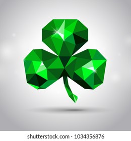 Polygonal emerald clover or shamrock on grey background. St. Patrick's day symbol