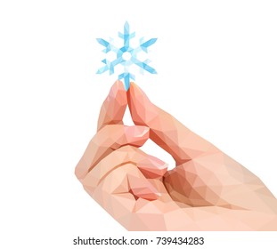 polygonal hand studio photo keeps polygonal New Year's snowflake in the fingers