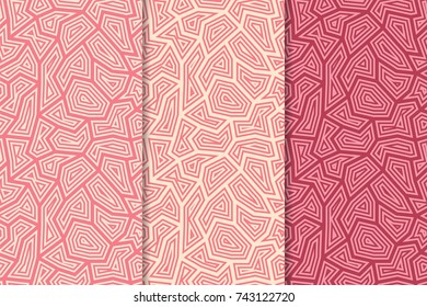 Polygonal seamless patterns. Set of cherry pink geometric backgrounds for textile and wallpapers