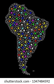 Polygonal vector map of South America with glow effect on a black background. Abstract triangles, lines, light colorful spots, nodes forms map of South America. White mesh,