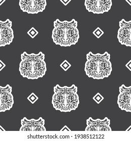 El tigre de estilo polinesio se enfrenta a un patrón ininterrumpido. Cara de tigre de Boho. Bien por antecedentes, impresiones, prendas de vestir y textiles. Ilustración vectorial.