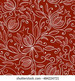 Pomegranate seamless pattern. Floral pattern with decorative pomegranate fruits and leaves. White pattern on red background