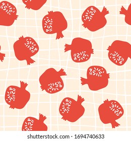 Pomegranate seamless pattern with pink cell background. Floral vector illustration of abstract doodle and scandinavian fruits. Garnet armenian pattern. 