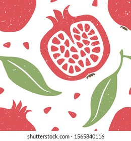 Pomegranate seamless pattern. Ripe garnet, grains and leaves on white background. Can be used for wallpaper, fabric, wrapping paper or decoration. Vector hand drawn illustration