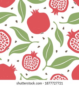 Pomegranate seamless pattern. Ripe garnet, grains and leaves on white background. Can be used for wallpaper, fabric, wrapping paper or decoration. Vector hand drawn illustration