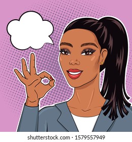 Pop art african american business woman in suit smiling and showing Ok sign with speech bubble for your message, vector illustration in retro comic style