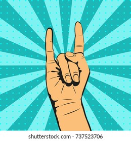 Pop art background with hand with rock n roll sign. Colorful hand drawn illustration in retro comic style.