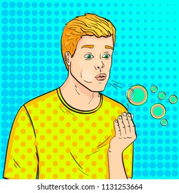 Pop art background. Young guy and soap bubbles. A game for children. Vector illustration, comic style.
