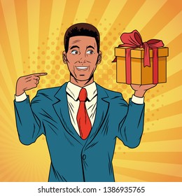 Pop art businessman with gift cartoon