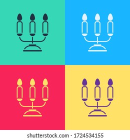 Pop art Candelabrum with three candlesticks icon isolated on color background.  Vector Illustration