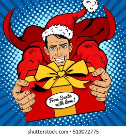 Pop art Christmas man. Young handsome man in red superhero costume and Santa Claus hat flies with big gift and smile . Vector illustration in retro comic style.