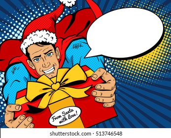 Pop art Christmas man. Young handsome man in superhero costume and Santa Clause hat flies with big Christmas gift from Santa and speech bubble. Vector illustration in retro pop art comic style.