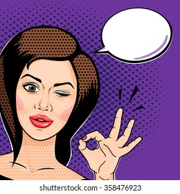 Pop art comics style Playful young woman winking and showing ok sign, thinking bubble for your message. Vector illustration.