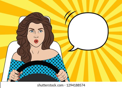 Pop art girl behind the wheel. Vector illustration in comic style.