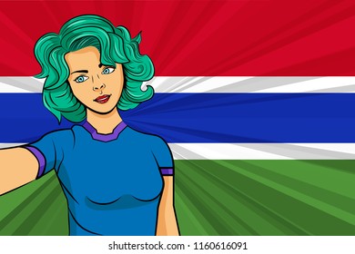Pop art girl with unicorn color hair style. Young fan girl makes selfie before the national flag of Gambia. Vector sport illustration in retro comic style