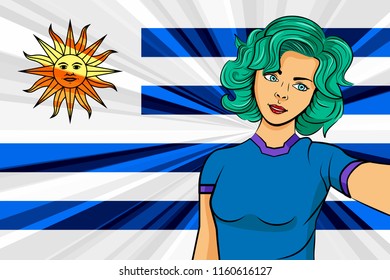 Pop art girl with unicorn color hair style. Young fan girl makes selfie before the national flag of Uruguay. Vector sport illustration in retro comic style