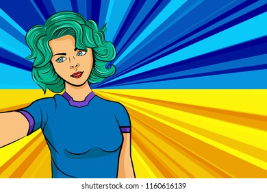 Pop art girl with unicorn color hair style. Young fan girl makes selfie before the national flag of Ukraine. Vector sport illustration in retro comic style