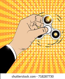 Pop Art Hand Playing with Popular Fidget Spinner Toy on a Yellow Background. Stress Relieving. Vector illustration.