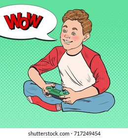 Pop Art Happy Boy Playing Video Game. Kid with Control Console. Vector illustration