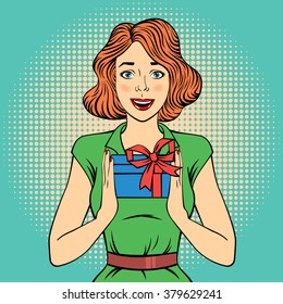 Pop Art Happy Woman Holding a Gift. Vector illustration in comic style