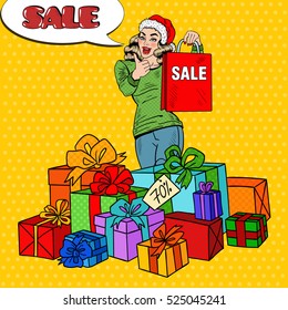 Pop Art Happy Woman in Santa Hat with Shopping Bag and Huge Gift Boxes on Christmas Sale. Vector illustration