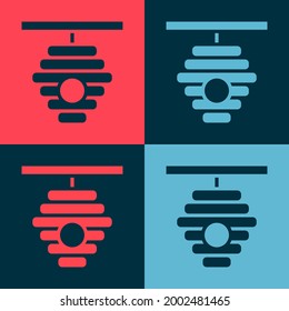 Pop art Hive for bees icon isolated on color background. Beehive symbol. Apiary and beekeeping. Sweet natural food.  Vector
