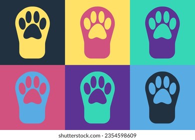 Pop art Paw print icon isolated on color background. Dog or cat paw print. Animal track.  Vector