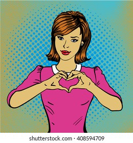 Pop art retro style woman showing heart hand sign. Comic hand drawn design vector illustration.