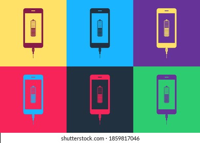 Pop art Smartphone battery charge icon isolated on color background. Phone with a low battery charge and with USB connection. Vector.