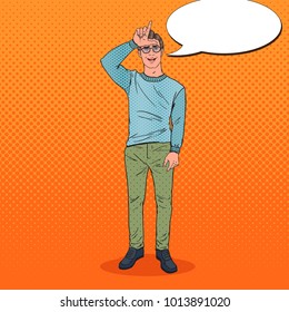 Pop Art Smiling Man Showing Loser Sign on Forehead. Negative Human Emotion Facial Expression. Vector illustration