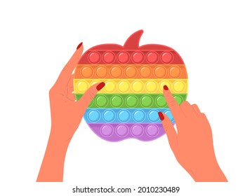 Pásalo. Juego sensorial de moda en manos femeninas. Los niños de la forma de manzana contra el estrés juegan. Juguete de mano colorido con burbujas de empuje. Ilustración vectorial al estilo de las caricaturas planas.