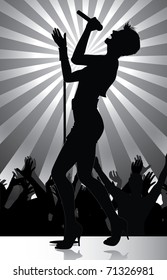 pop singer performing on stage with crowd cheering (available jpg version)