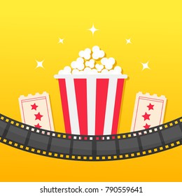 Popcorn box. Film strip rounded. Two tickets admit one. Cinema icon set in flat design style. Pop corn icon. Yellow gradient background. Shining stars. Vector illustration