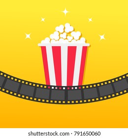 Popcorn box. Film strip rounded. Movie Cinema icon in flat design style. Pop corn icon. Yellow gradient background. Shining stars. Vector illustration