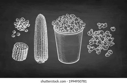 Popcorn in cup. Corncob and handful of corn kernels. Chalk sketch set on blackboard background. Hand drawn vector illustration. Retro style.