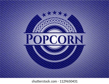 Popcorn emblem with jean background