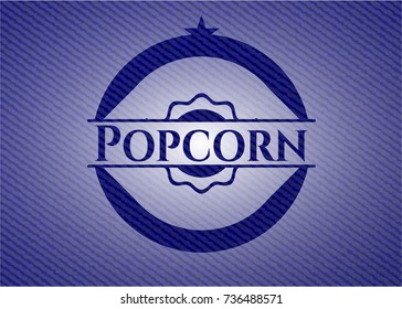 Popcorn emblem with jean background