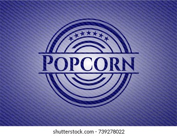 Popcorn emblem with jean background