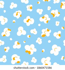Popcorn fluffy flakes on light blue background, vector seamless pattern