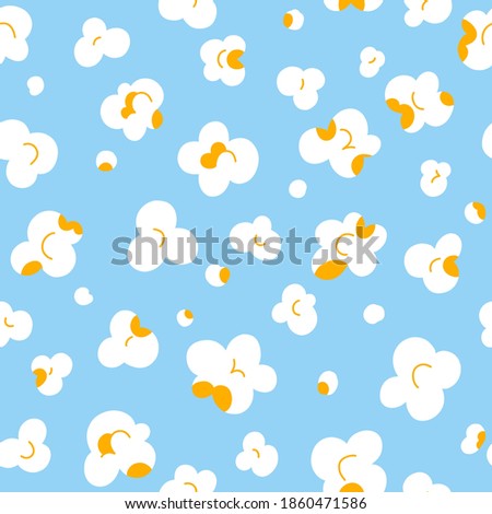 Popcorn fluffy flakes on light blue background, vector seamless pattern