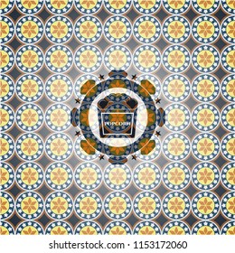 popcorn icon inside arabesque style emblem. arabic decoration.