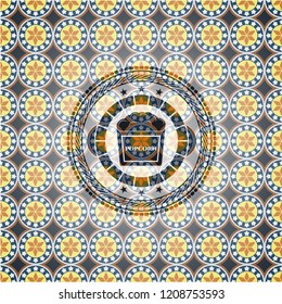 popcorn icon inside arabic style emblem. Arabesque decoration.