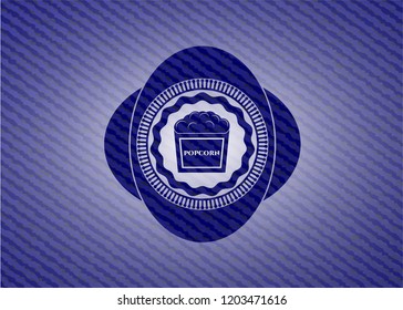 popcorn icon inside badge with denim background