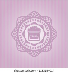 popcorn icon inside badge with pink background
