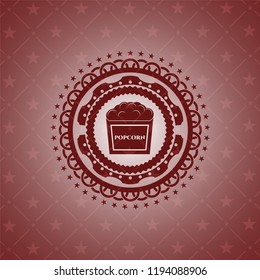 popcorn icon inside badge with red background