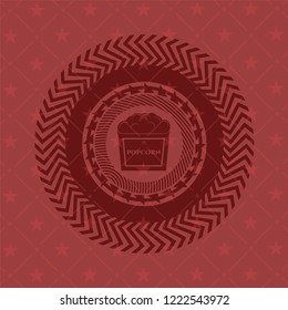 popcorn icon inside badge with red background